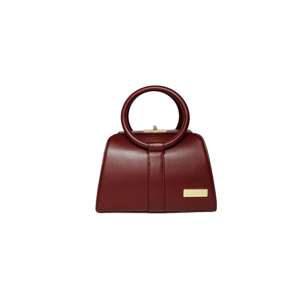 burgundy kaila katherine vegan leather bloomsbury handbag with circular handle